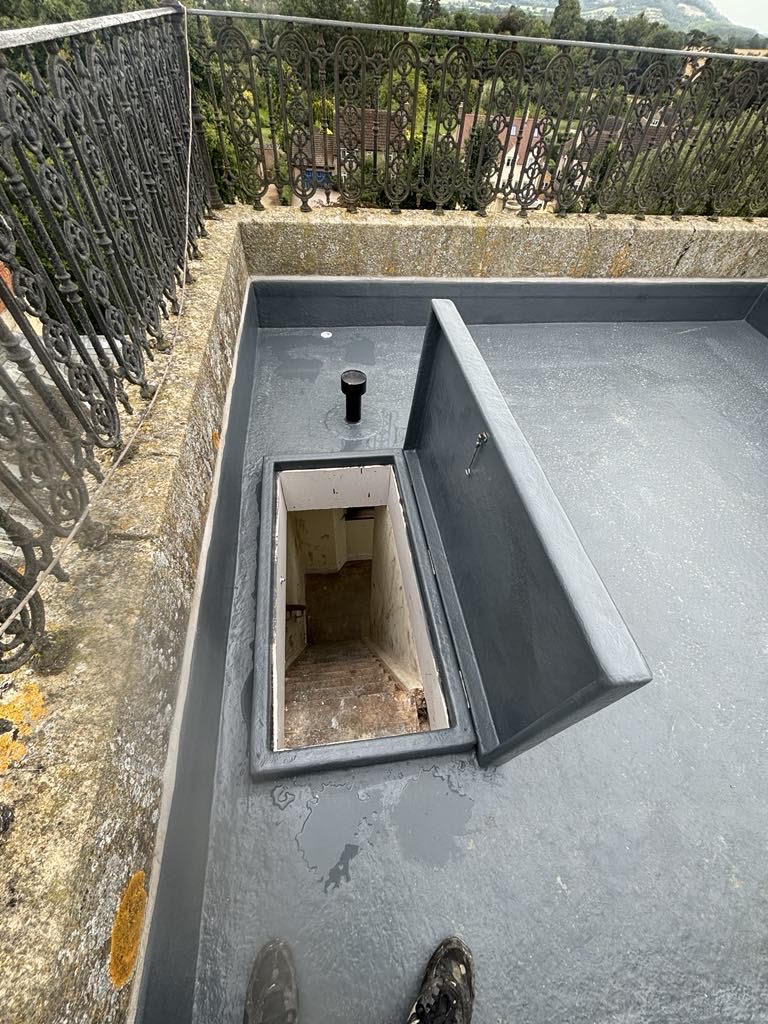 Completed Beckford Grange roof — marine-grade fibreglass finish with 25-year guarantee by O.F Carpentry and Building