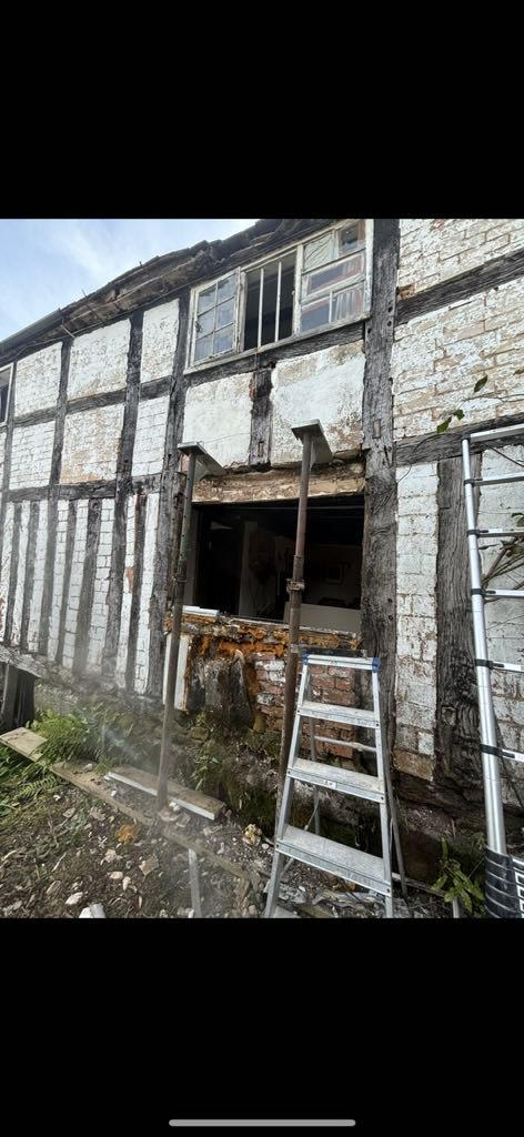 Removal of original window and damaged brickwork during restoration